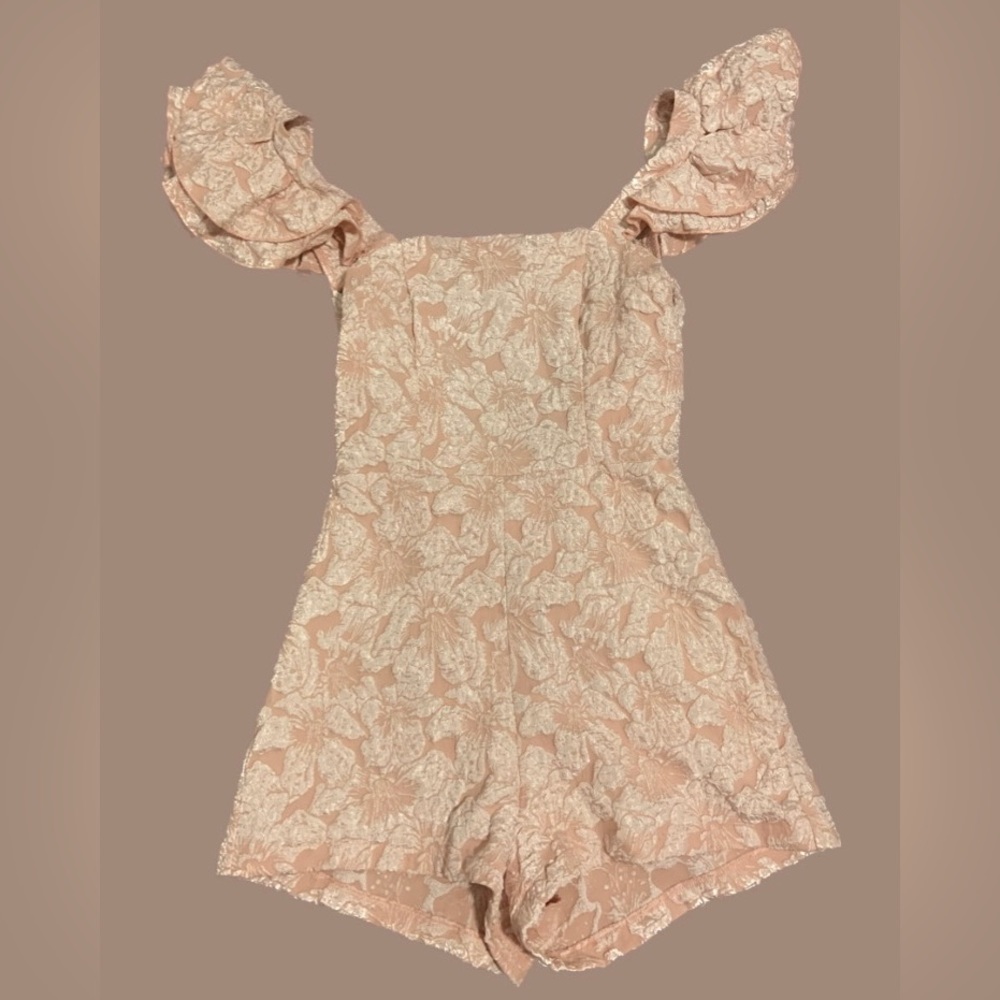 Ruffle trim tie backless Romper. Size extra small